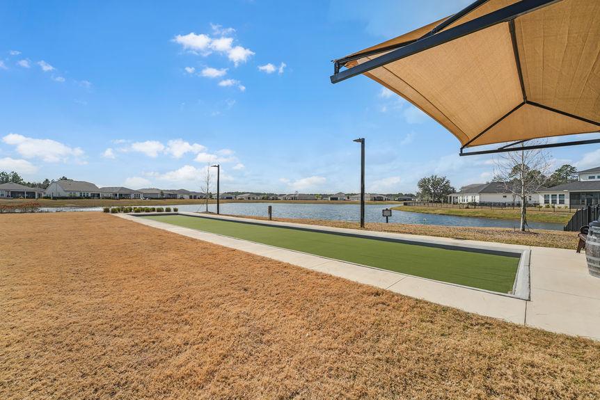 Luxurious 55+ community amenities, including a pool, clubhouse, and walking trails at Reverie at Trailmark in St. Augustine.