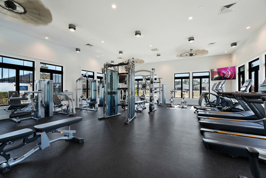 Luxurious 55+ community amenities, including a pool, clubhouse, and walking trails at Reverie at Trailmark in St. Augustine.