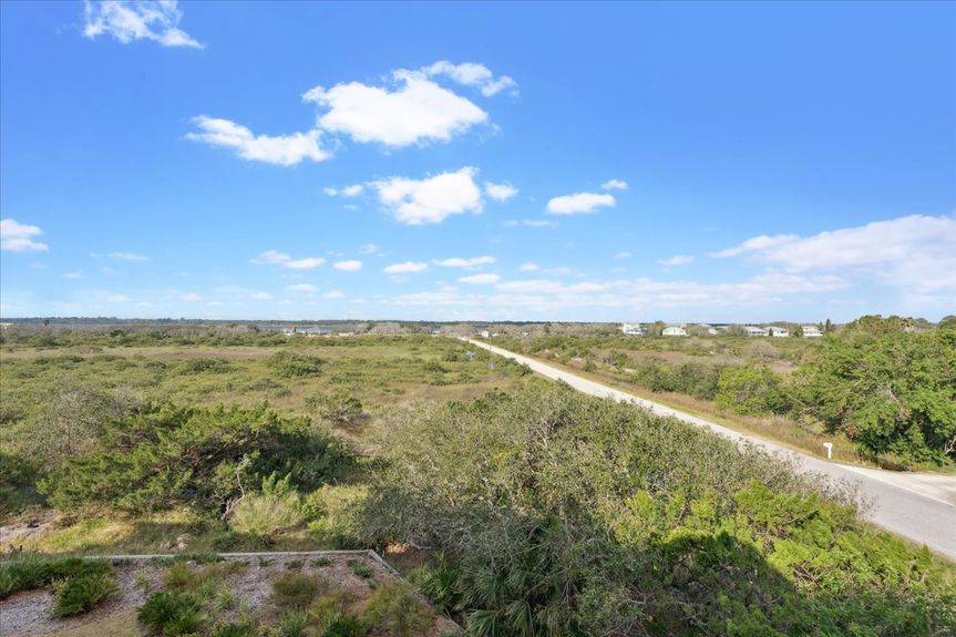 Aerial view of 170 Pantano Cay Blvd Unit 4305, a third-floor corner condo in The Estuaries, showcasing its proximity to the Intracoastal Waterway and Mary Street Beach Access.