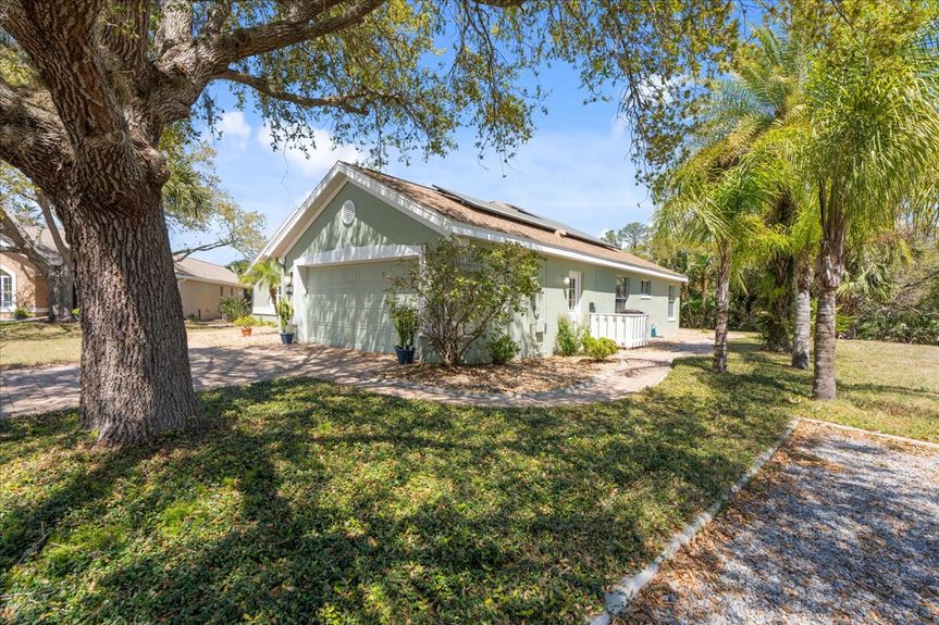 Well-maintained two-car garage at 192 Anastasia Lakes Drive, featuring a paved driveway and ample storage space.