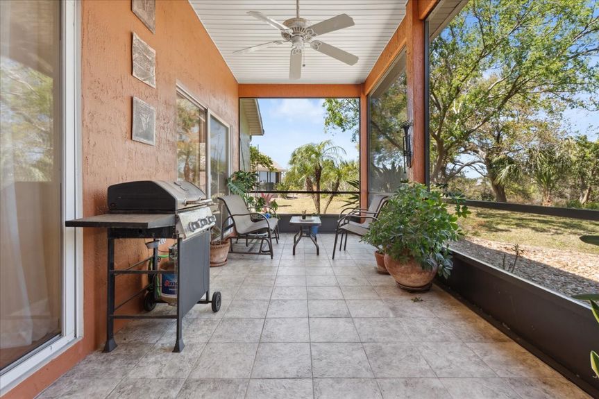 Large screened-in lanai with tranquil views of the marsh