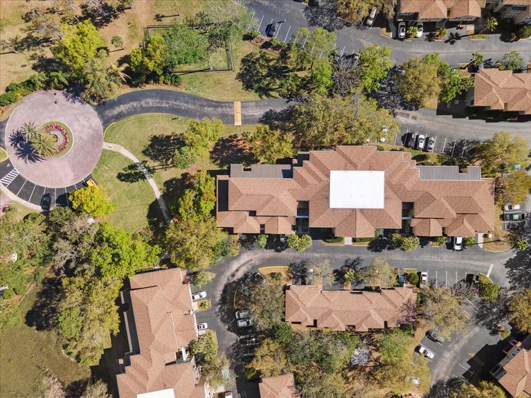 Aerial shot of the condo building at 4000 Grande Vista Blvd, Unit 15-104, showing its modern architecture and layout within the Las Palmas community.