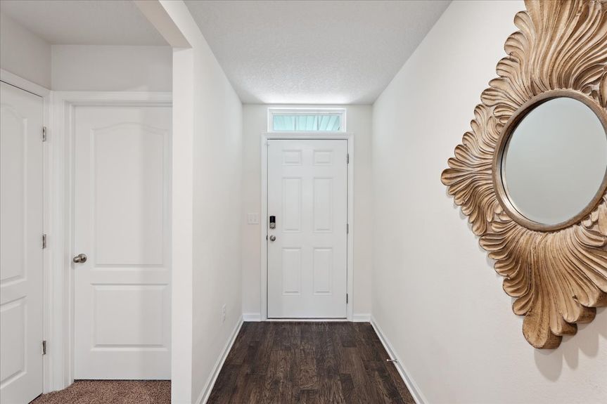 Single-story move-in ready home with 3 bedrooms, 2 baths, screened lanai, and pond views near community pool, pickleball courts, and fitness center.