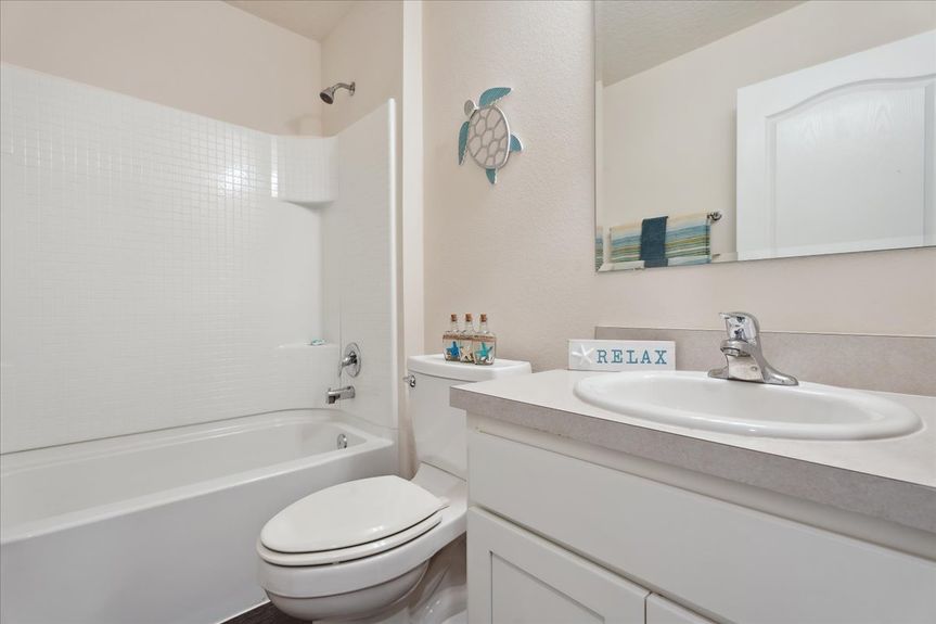 Move-in ready 3-bedroom, 2-bath home with open floor plan, stainless steel kitchen, screened lanai, pond views, and access to resort-style amenities!