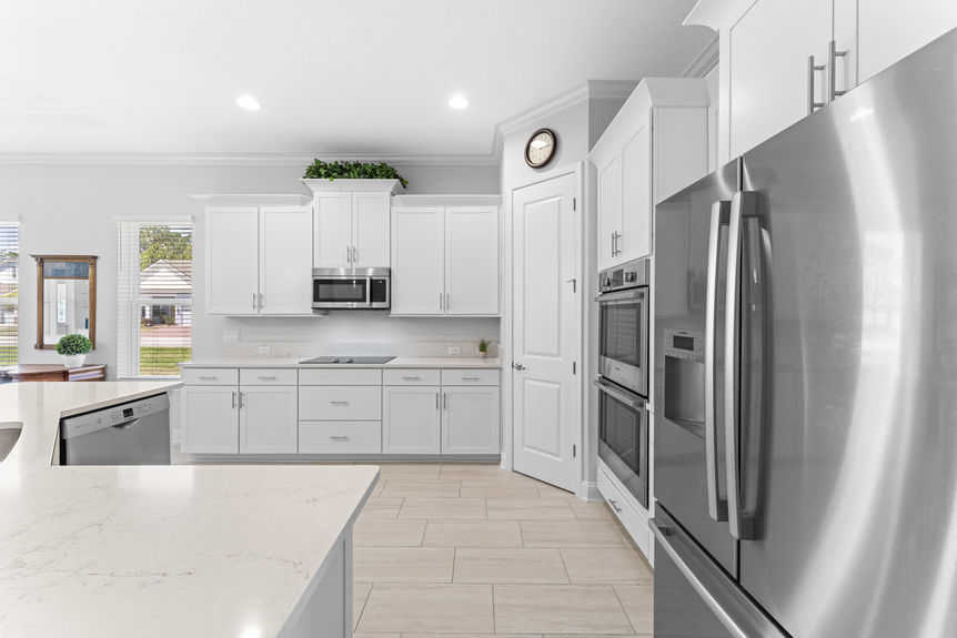 Kitchen with granite countertops, stainless steel appliances, and adjacent dining area
