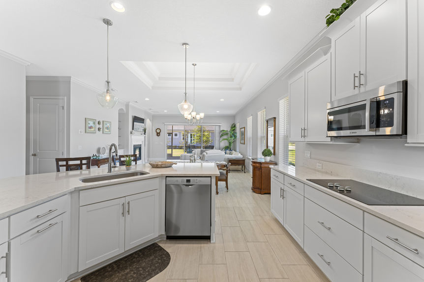 Kitchen with granite countertops, stainless steel appliances, and adjacent dining area