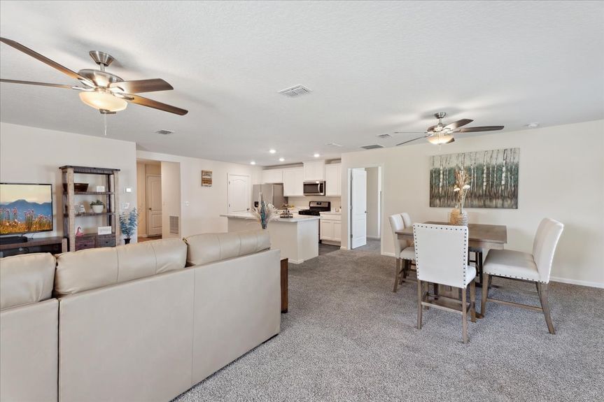 Single-story move-in ready home with 3 bedrooms, 2 baths, screened lanai, and pond views near community pool, pickleball courts, and fitness center.