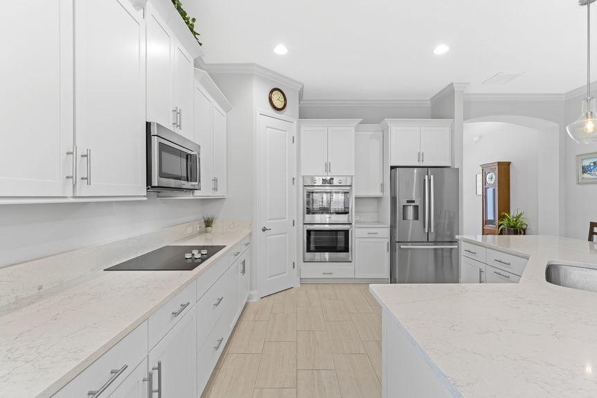 Kitchen with granite countertops, stainless steel appliances, and adjacent dining area