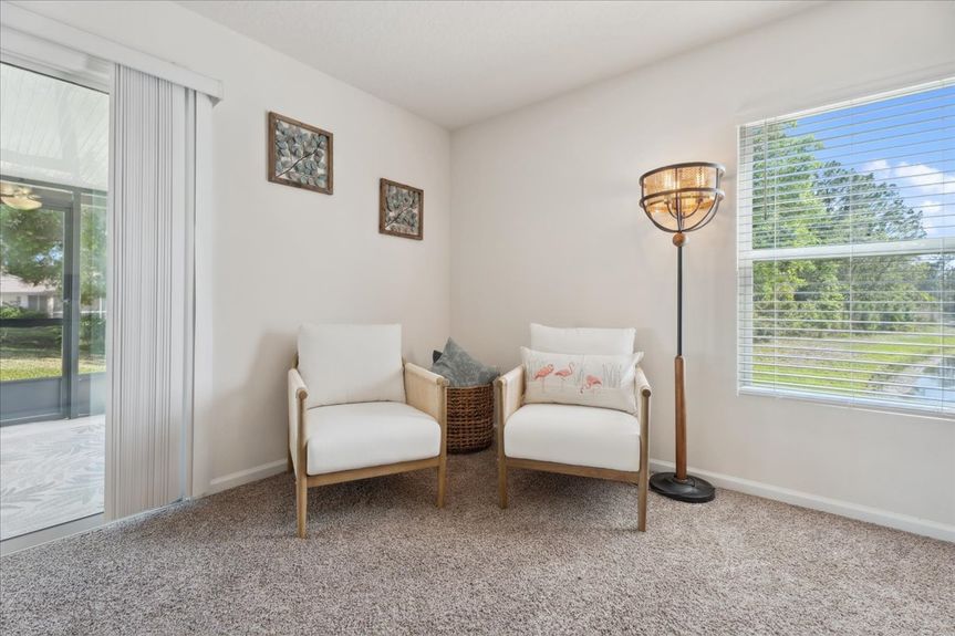 Single-story move-in ready home with 3 bedrooms, 2 baths, screened lanai, and pond views near community pool, pickleball courts, and fitness center.