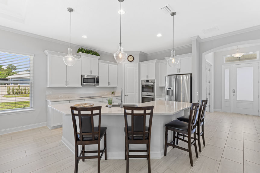 Kitchen with granite countertops, stainless steel appliances, and adjacent dining area