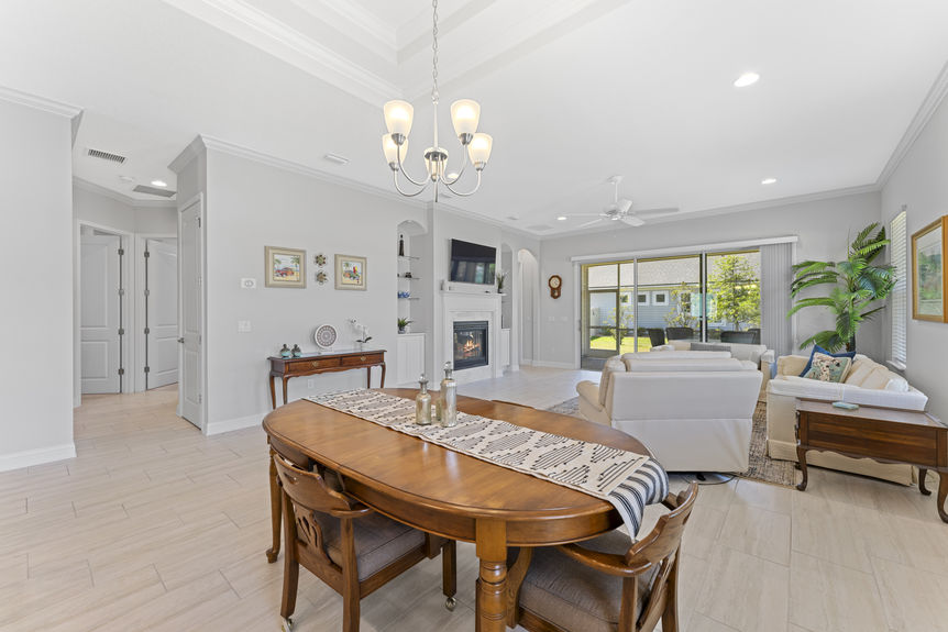 Dining area in open floorplan home with natural light and connection to kitchen and living room
