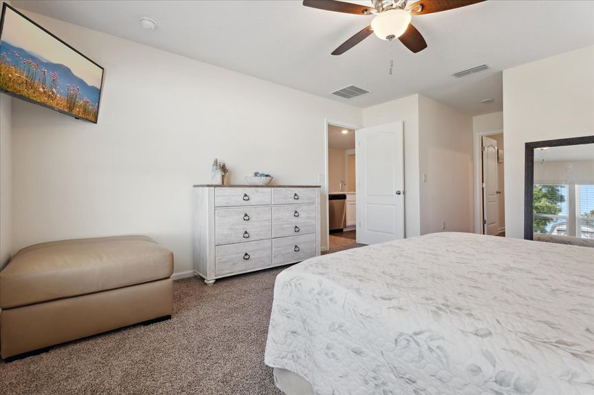 Single-story move-in ready home with 3 bedrooms, 2 baths, screened lanai, and pond views near community pool, pickleball courts, and fitness center.