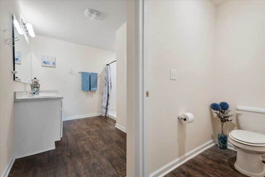 Single-story move-in ready home with 3 bedrooms, 2 baths, screened lanai, and pond views near community pool, pickleball courts, and fitness center.