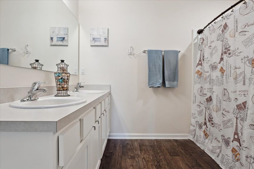 Single-story move-in ready home with 3 bedrooms, 2 baths, screened lanai, and pond views near community pool, pickleball courts, and fitness center.