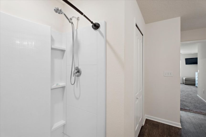Single-story move-in ready home with 3 bedrooms, 2 baths, screened lanai, and pond views near community pool, pickleball courts, and fitness center.