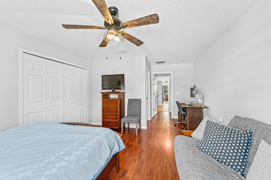 Bathroom with sleek vanity, neutral finishes, and natural light in St. Augustine pool home