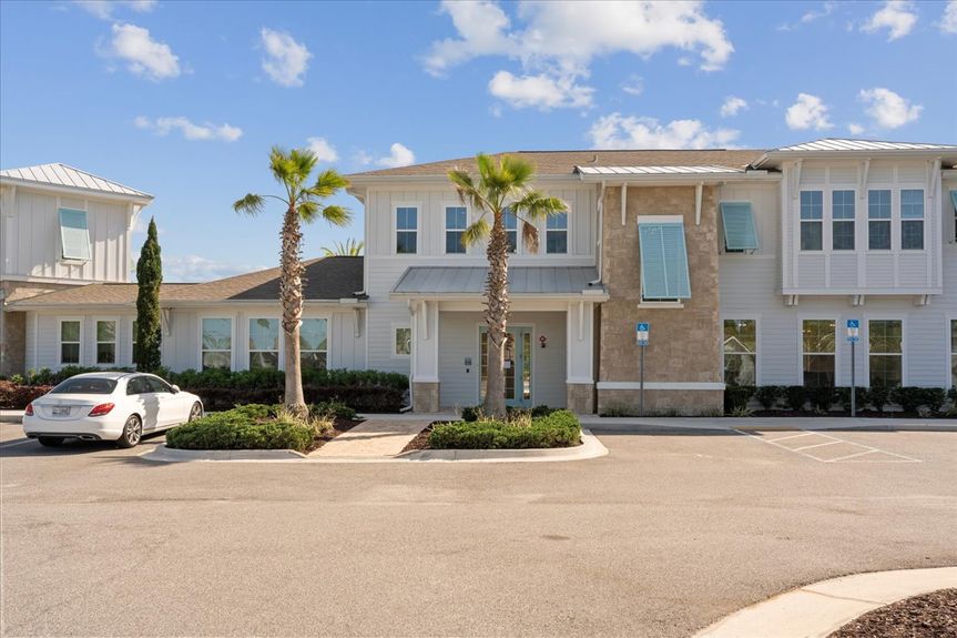 Single-story move-in ready home with 3 bedrooms, 2 baths, screened lanai, and pond views near community pool, pickleball courts, and fitness center.