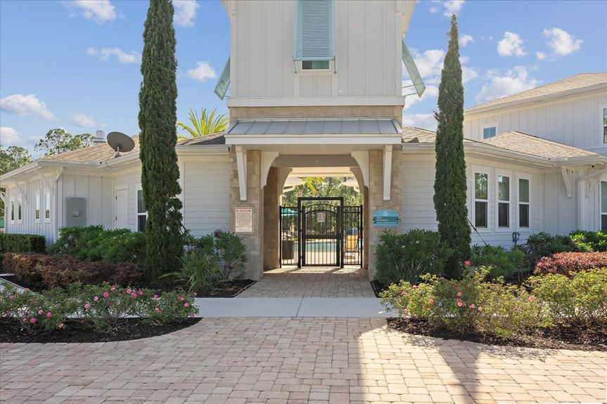 Single-story move-in ready home with 3 bedrooms, 2 baths, screened lanai, and pond views near community pool, pickleball courts, and fitness center.