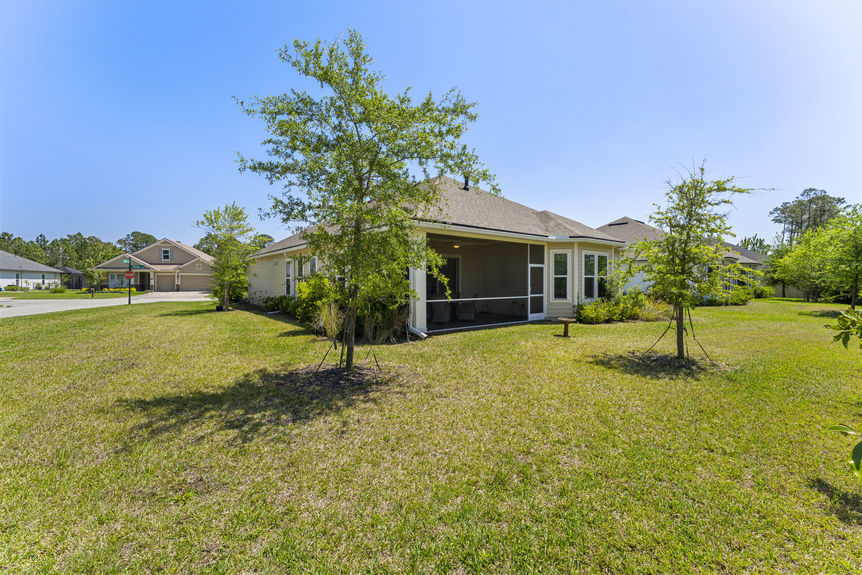 backyard with lush lawn on corner lot in St. Augustine’s Madeira community