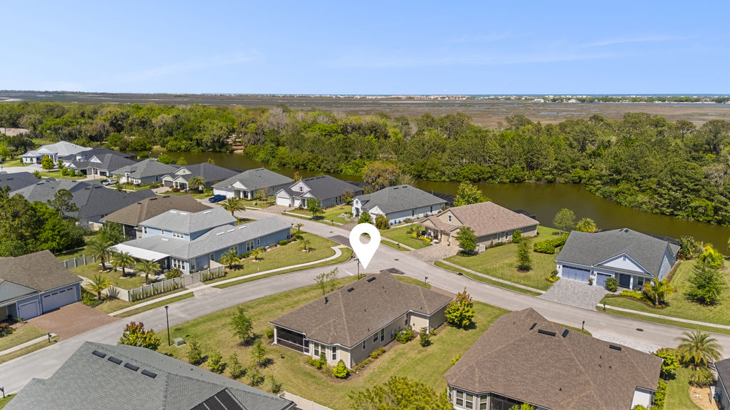 Overhead view of a 3-bedroom home with 3-car garage on a corner lot in the Madeira community, St. Augustine