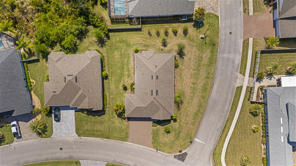 Overhead view of a 3-bedroom home with 3-car garage on a corner lot in the Madeira community, St. Augustine