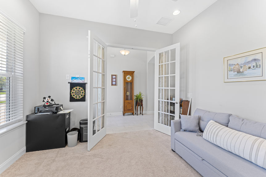 Home office space with desk and window in corner lot home
