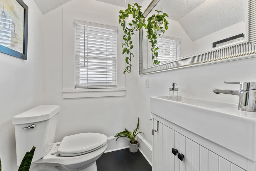 Bathroom with classic tile, updated fixtures, and vintage accents in Lincolnville St. Augustine home
