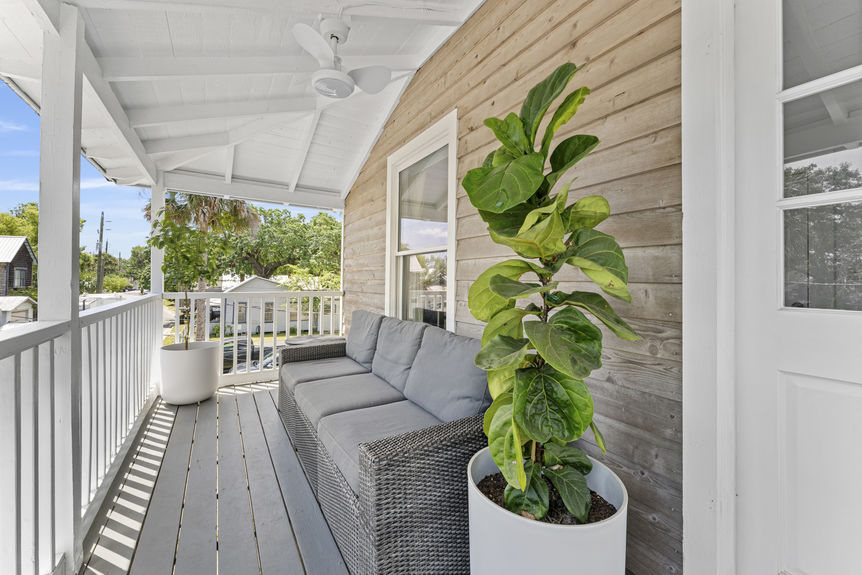 Covered porch with seating overlooking historic Lincolnville neighborhood in St. Augustine