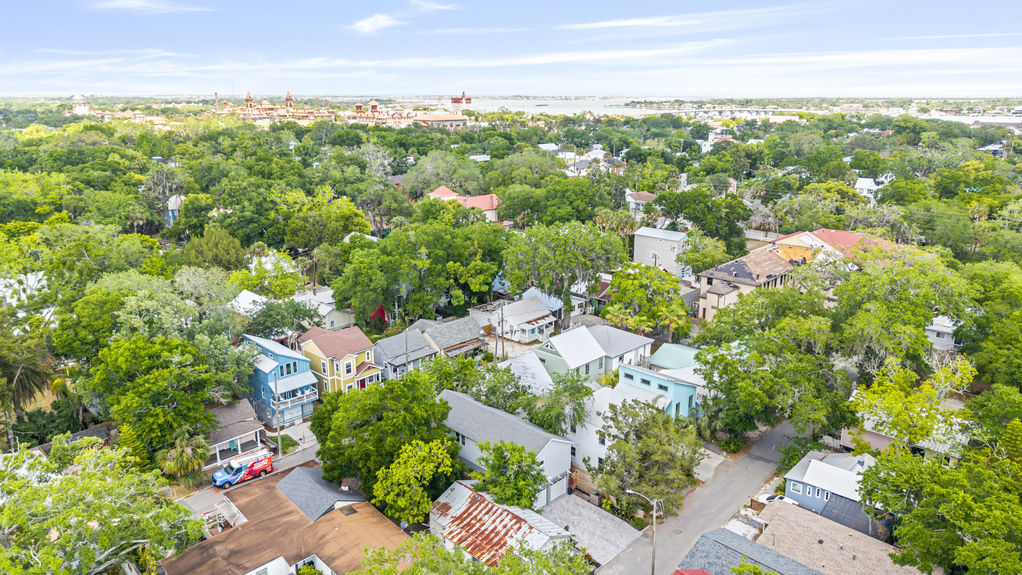 Aerial view of a stilted 3-bedroom cottage with dual street access in Lincolnville, St. Augustine