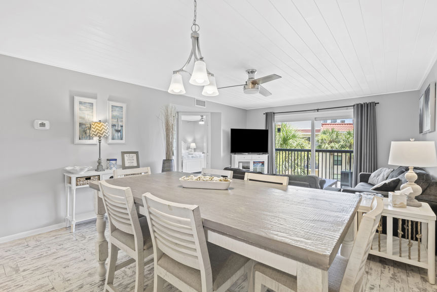 Open living and dining area with access to private balcony in St. Augustine Beach