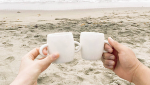 Retired couple enjoying coffee by the beach in St. Augustine