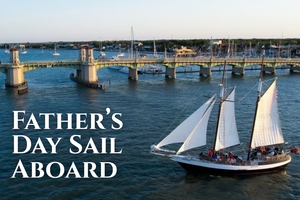 A schooner sailing near the Bridge of Lions in St. Augustine, Florida, with text overlay: “Father’s Day Sail Aboard.