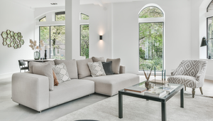 A clean and staged living room with natural lighting, prepared for a home showing.
