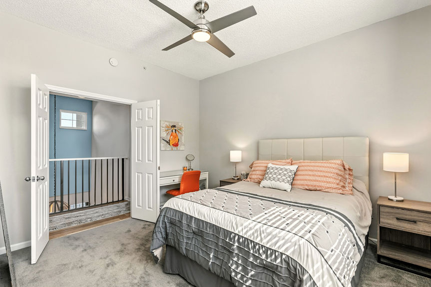 Master bedroom with large window and double closets, perfect for serene living