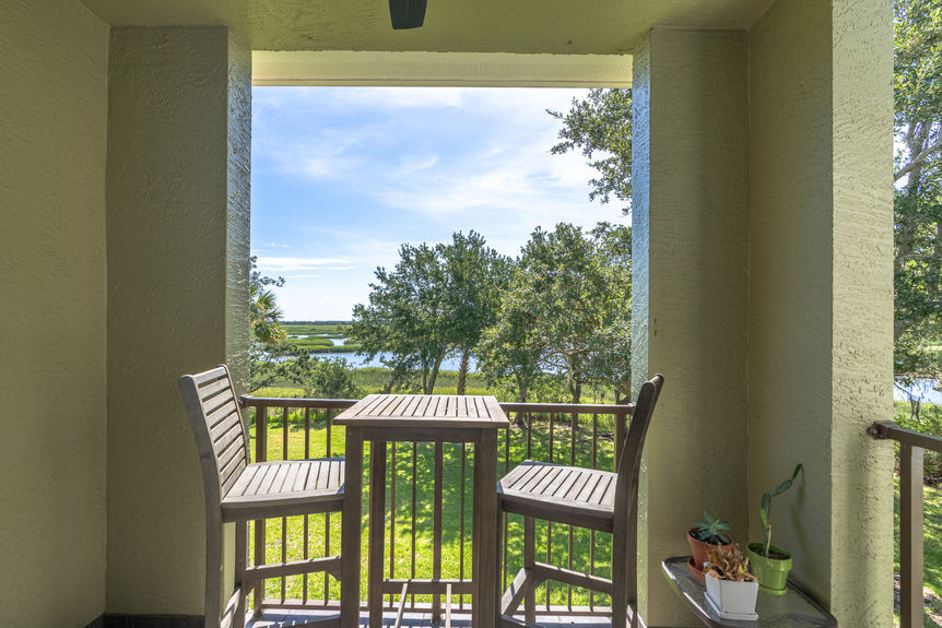 32_homeprimemedia-Private marsh-view balcony with seating — ideal for relaxing or entertaining