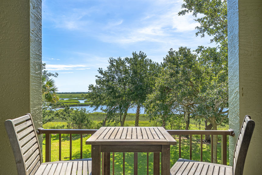 32_homeprimemedia-Private marsh-view balcony with seating — ideal for relaxing or entertaining