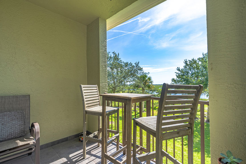 32_homeprimemedia-Private marsh-view balcony with seating — ideal for relaxing or entertaining