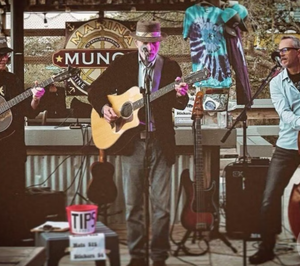 Live acoustic band performing at Marina Munch in St. Augustine with food trucks and a family-friendly atmosphere
