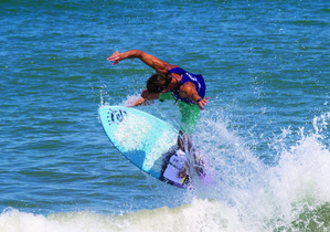 Surfer performing a trick at the Florida Skimboarding Pro/Am Tournament in Vilano Beach, St. Augustine, FL.