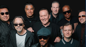 Group photo of UB40 band members ahead of their live performance at St. Augustine Amphitheatre.
