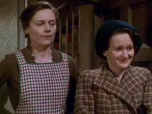 Scene from the classic film “This Happy Breed” showing two women in period clothing, featured in a special screening at the Unitarian Universalist Fellowship in St Augustine, Florida.