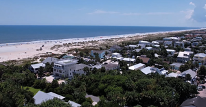 Aerial view of beachfront homes and communities along St. Augustine Beach, Florida.
