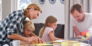 Smiling family with children preparing for relocation, representing family life in St. Augustine, Florida