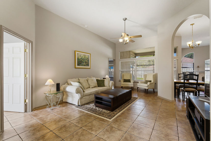 Open living room with tile floors and natural light in a St. Johns Florida home