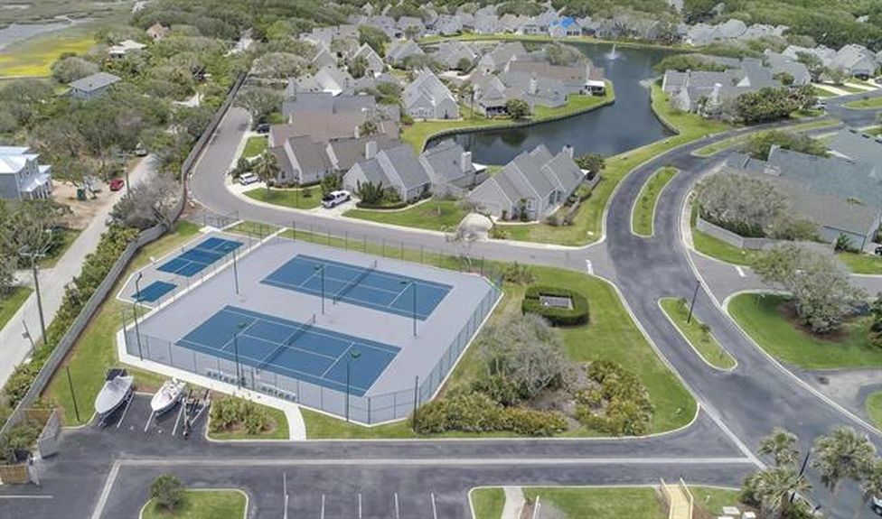 Aerial perspective of the professional tennis courts and scenic ponds within the gated Villages of Vilano community near 364 Village Dr.