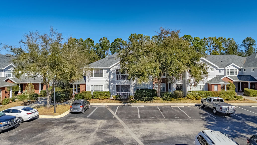 Drone photo of the main clubhouse building and brick-paved entrance at Harbour Vista Cir, St. Augustine, FL.