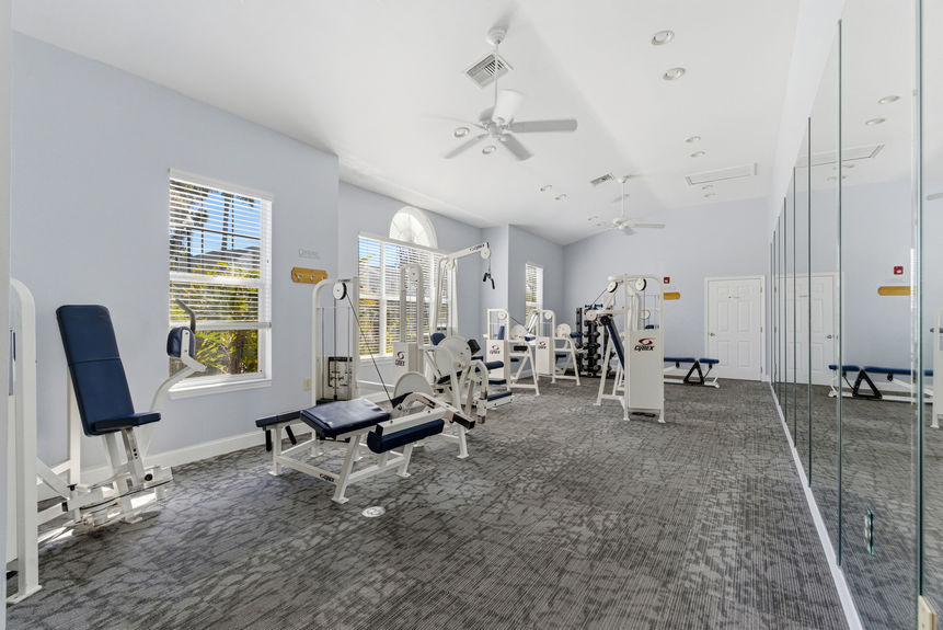 Community gym at Harbour Vista Cir with treadmills, ellipticals, and stationary bikes in St. Augustine, Florida.