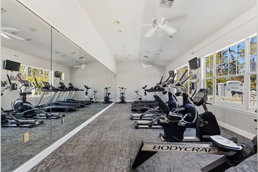 Community gym at Harbour Vista Cir with treadmills, ellipticals, and stationary bikes in St. Augustine, Florida.