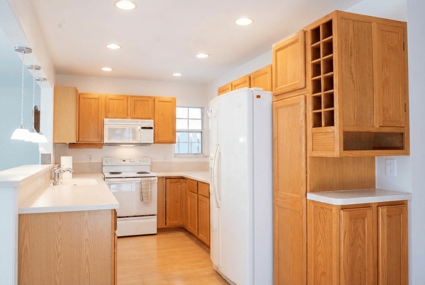Detailed interior shot of the kitchen at 364 Village Dr showing ample cabinet space, pantry storage, and recessed lighting.