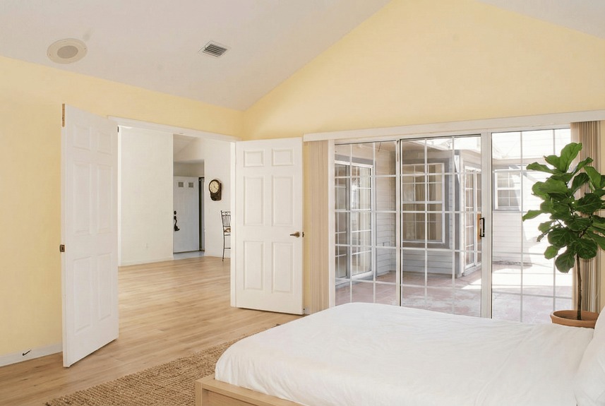 Interior view of 364 Village Dr showing the transition from the living area to a private outdoor patio through sliding glass doors.